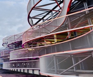 Neon-lit steel curves rising against the Bucharest sky