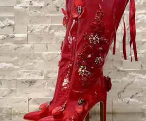 Crimson Secret Garden Couture Boots — Glossy crimson, cascading satin ribbons and architectural gold-toned heels.