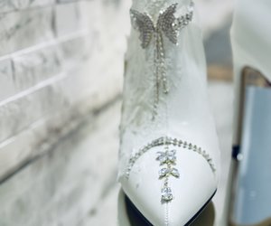 Étoile Blanche Crystal Lace Couture Boots — A jeweled bow motif with slender crystal tails falling over the pointed toe.