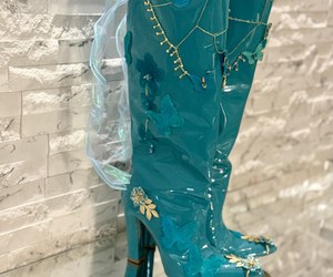 Élysée Papillon — A side view of the pointed toes, butterfly appliqués and architectural high heels.